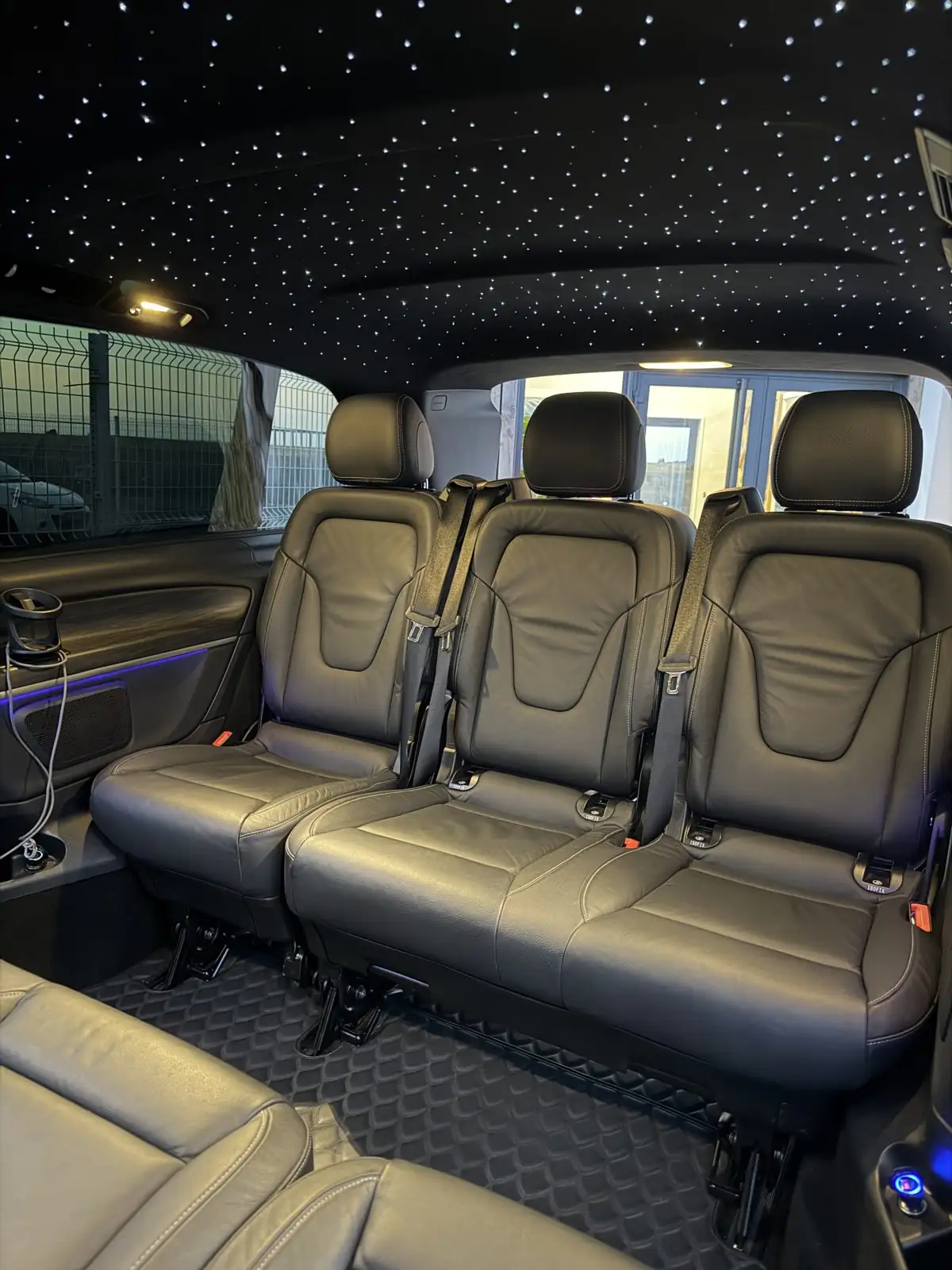 Inside the MyCourse van, three seats and starlit ceiling