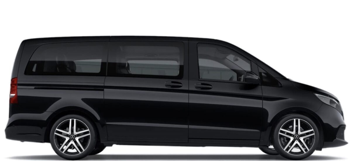 Modern Black Passenger Van Black modern passenger van with tinted windows and alloy wheels, side view.