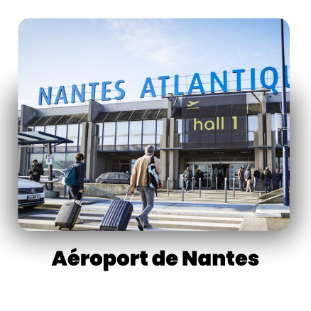 Nantes Atlantique Airport exterior with travelers entering hall 1 on a clear day.